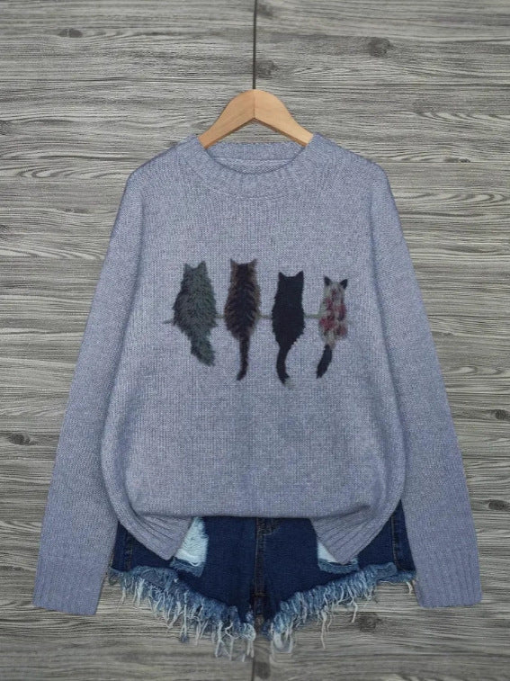 Crew neck  knitted pullover sweater with a cat pattern.