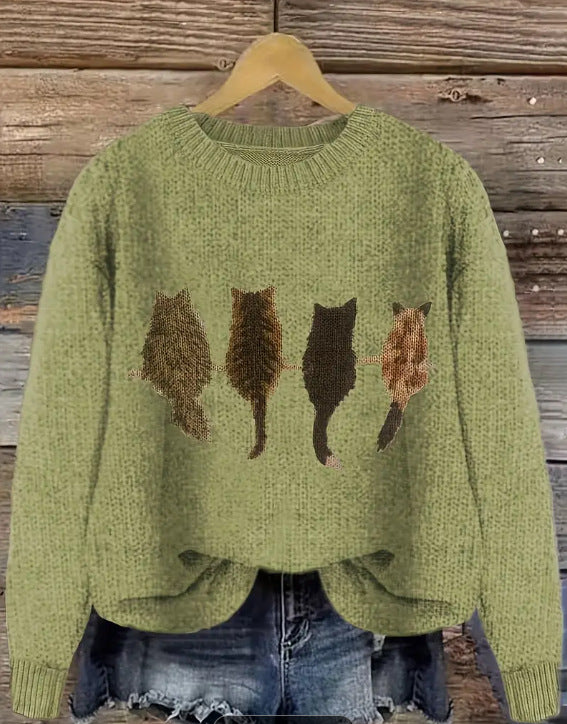 Crew neck  knitted pullover sweater with a cat pattern.